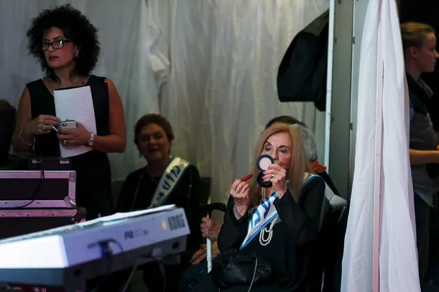 Rita Casimo Brown, 81, (C) a Holocaust survivor, has her make-up done during a beauty contest for survivors of the Nazi genocide in the northern Israeli city of Haifa, November 24, 2015. (Photo by Amir Cohen/Reuters)