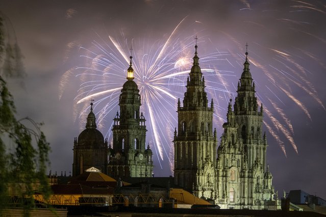 Fireworks illuminates the night sky above the Santiago de Compostela Arch cathedral Basilica to start the celebrations for Saint James Day, to honor the patron saint of the city, in Santiago de Compostela, northwestern Spain, late 24 July 2024. St. James Day is marked annually on 25 July. (Photo by Xurxo Martinez/EPA)