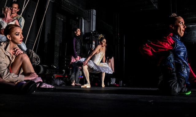 Katherine Rodriguez (2R) of Chile, stretches at the back stage as she waits for her performance during International Ballet Festival of Miami at The Fillmore Theater in Miami Beach, Florida on August 10, 2024. (Photo by Chandan Khanna/AFP Photo)