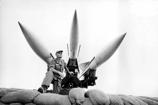 Gen. William C. Westmoreland, commander of U.S. Forces in South Vietnam, stands beneath a three combat-ready Hawk antiaircraft missiles at Da Nang, Vietnam, February 21, 1965. The General is inspecting two batteries of U.S. Marine Corps Hawks. (Photo by AP Photo)