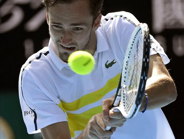 Russia's Daniil Medvedev hits a backhand return to Serbia's Filip Krajinovic during their third round match at the Australian Open tennis championship in Melbourne, Australia, Saturday, February 13, 2021. (Photo by Andy Brownbill/AP Photo)