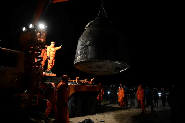The re-entry capsule of China's Shenzhou-11 spacecraft is loaded on a truck, north of Inner Mongolia Autonomous Region, China, November 18, 2016. (Photo by Reuters/China Daily)
