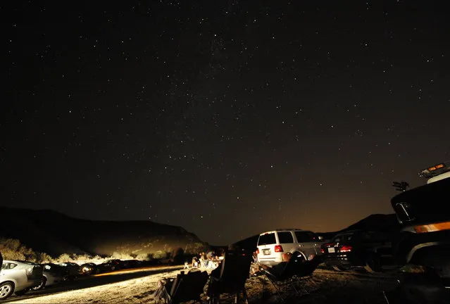 Stargazers come out to watch the Perseid meteor shower early on Monday morning north of Castaic Lake, California August 12, 2013. (Photo by Gene Blevins/Reuters)