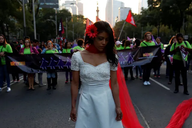 A woman takes part in a demonstration to commemorate the U.N. International Day for the Elimination of Violence against Women in Mexico City, Mexico, November 25, 2016. (Photo by Carlos Jasso/Reuters)