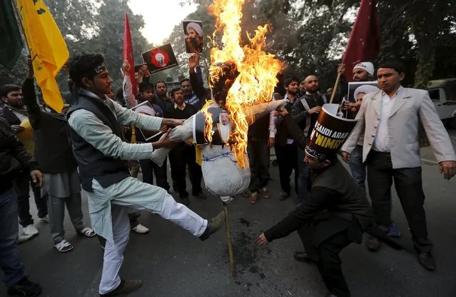 Shi'ite Muslims burn an effigy of Saudi King Salman bin Abdulaziz during a protest against the execution of cleric Nimr al-Nimr, who was executed along with others in Saudi Arabia, in front of Saudi Arabia embassy in New Delhi, India, January 4, 2016. (Photo by Adnan Abidi/Reuters)