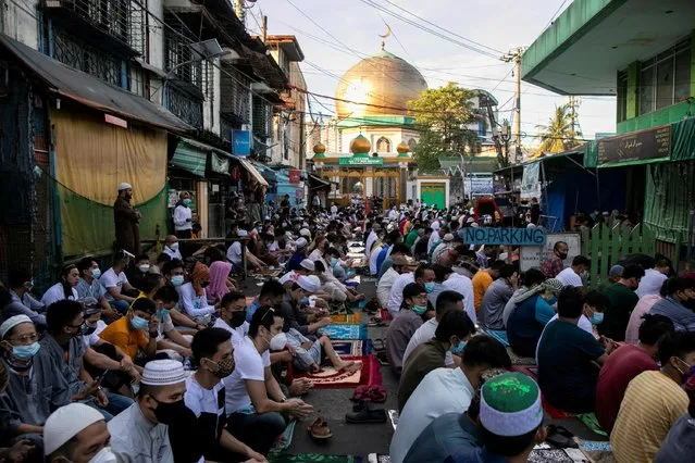Filipino Muslims attend the morning prayer on Eid al-Fitr outside the Manila Golden Mosque, amid the coronavirus disease (COVID-19) outbreak in Quiapo, Manila, Philippines, May 13, 2021. (Photo by Eloisa Lopez/Reuters)