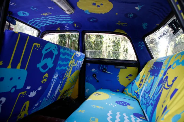 In the fitting process the fabric is applied to seats, door panels and ceilings. (Photo by Vinit Bhatt/Taxi Fabric/The Guardian)