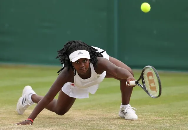 Hephzibah Oluwadare of Great Britain stretches to play a forehand in her Girls' Singles First Round match against Sara Bejlek of The Czech Republic during Day Seven of The Championships – Wimbledon 2021 at All England Lawn Tennis and Croquet Club on July 05, 2021 in London, England. (Photo by Clive Brunskill/Getty Images)