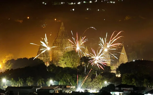 Fireworks seen over Prambanan temple complex during a countdown event to celebrate the New Year on January 1, 2017 in Yogyakarta, Indonesia. (Photo by Jefta Images/Barcroft Images)