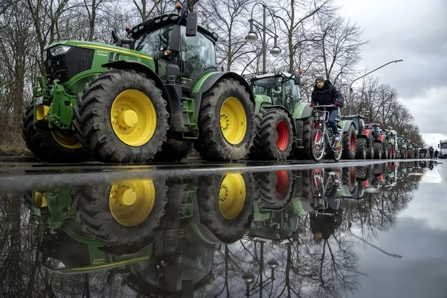 Farmers place their tractors at the government district in Berlin, Germany, Monday, January 15, 2024 ahead of a demonstration. Farmers drove thousands of tractors into Berlin on Monday in the climax of a week of demonstrations against a plan to scrap tax breaks on the diesel they use, a protest that has tapped into wider discontent with Germany’s government. (Photo by Ebrahim Noroozi/AP Photo)
