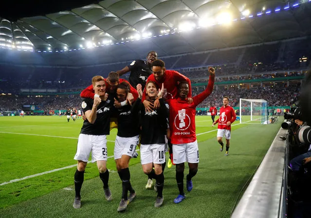 Emil Forsberg of Leipzig celebrates scoring the third goal with his teamates during the DFB Cup semi final match between Hamburger SV and RB Leipzig at Imtech Arena on April 23, 2019 in Hamburg, Germany. (Photo by Kai Pfaffenbach/Reuters)