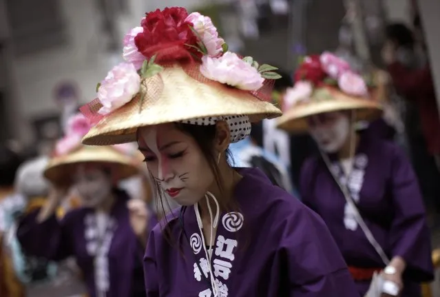 Participants prepare to parade through precincts of the Kanda Myojin shrine during the annual summer festival in Tokyo, Saturday, May 9, 2015. (Photo by Eugene Hoshiko/AP Photo)