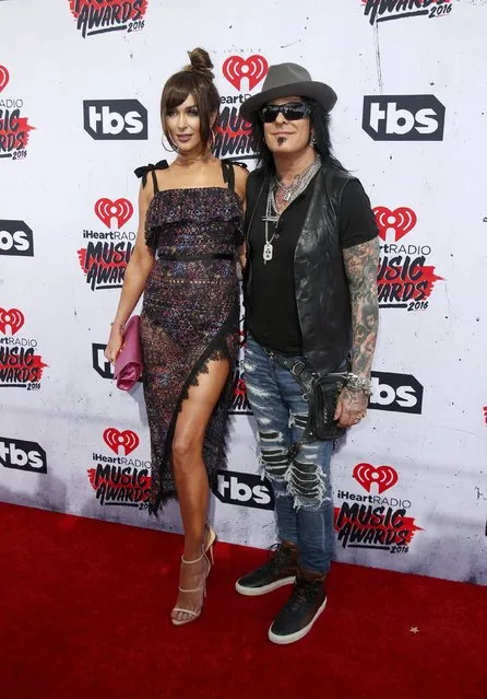 Musician Nikki Sixx (R) and his wife Courtney Sixx pose at the 2016 iHeartRadio Music Awards in Inglewood, California, April 3, 2016. (Photo by Danny Moloshok/Reuters)