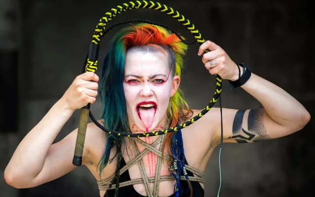Festival Fringe entertainer Demon Child swallows a sword during a performance on the Royal Mile  in Edinburgh Scotland on August 8, 2019. The festival takes place in the Scottish capital 2 to 26 August, and is marking it's 72nd anniversary, this year sees some 3,841 shows performed in the world's oldest fringe festival, that runs alongside the Edinburgh International Festival. (Photo by Lesley Martin/The Telegraph)