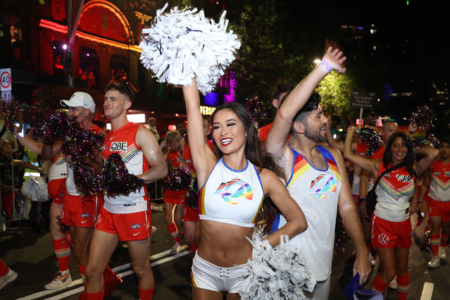 Members of the Sydney Swans Football Club and LA Rams cheerleaders walk in the Sydney Gay & Lesbian Mardi Gras Parade as part of Sydney WorldPride on February 25, 2023 in Sydney, Australia. The Sydney Gay and Lesbian Mardi Gras parade returns to Oxford Street in celebration of the event's 45th anniversary. The parade began in 1978 as a march to commemorate the 1969 Stonewall Riots in New York and has been held every year since to promote awareness of gay, lesbian, bisexual and transgendered issues. (Photo by Brendon Thorne/Getty Images)