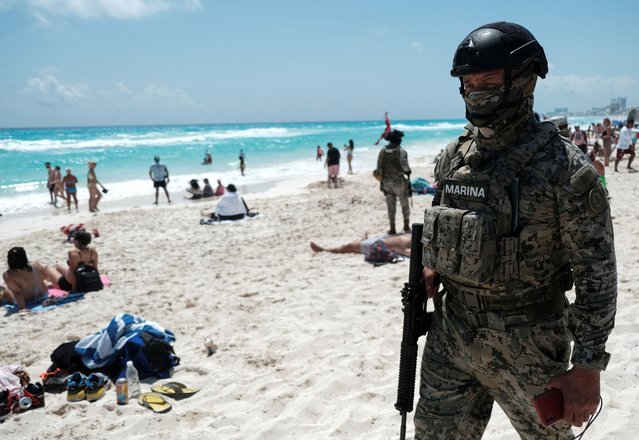 A member of the Navy patrols the Gaviota Azul beach during the beginning of the spring break, in Cancun, Mexico on March 18, 2023. (Photo by Paola Chiomante/Reuters)