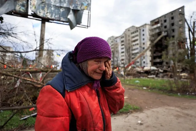 Zinaida Makishaiva, 82, reacts as she recounts how Russian soldiers treated her, amid Russia's Invasion of Ukraine, in Borodyanka, Kyiv region, Ukraine on April 11, 2022. Zinaida said “They came to my house and said go to the basement, “b*tch”.  She put a sign on her house reading “there are people here” Soldiers started to shoot around her to scare her. “God saved my life”. (Photo by Zohra Bensemra/Reuters)