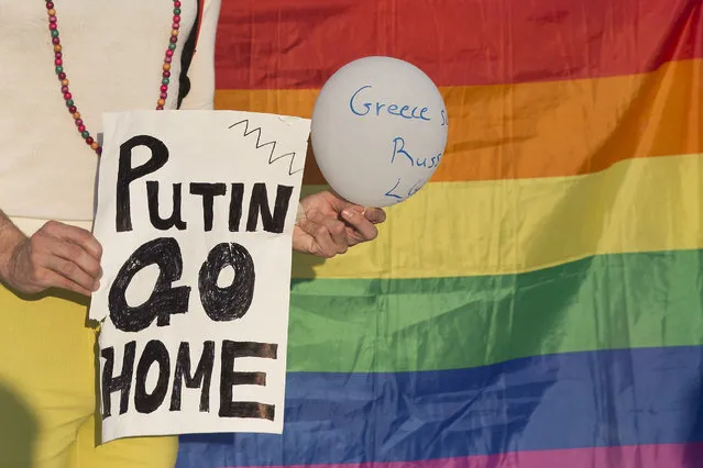 Protesters from a Greek gay and lesbian rights group gather in front of parliament, to protest a visit by Russian President Vladimir Putin, on Friday, May 27, 2016. The protesters said violence against gays in Russia is still largely unpunished by authorities. (Photo by Petros Giannakouris/AP Photo)