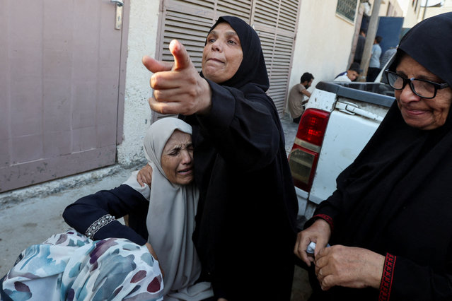 Mourners react during the funeral of Palestinians killed in Israeli strikes, amid the Israel-Hamas conflict, at Al-Aqsa Martyrs hospital in Deir Al-Balah in the central Gaza Strip on August 27, 2024. (Photo by Ramadan Abed/Reuters)