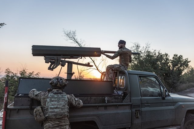 Ukrainian soldier loads shells into a vehicle adapted to fire helicopter shells in the direction of Toretsk, in Donetsk Oblast, Ukraine on August 19, 2024. (Photo by Diego Herrera Carcedo/Anadolu via Getty Images)