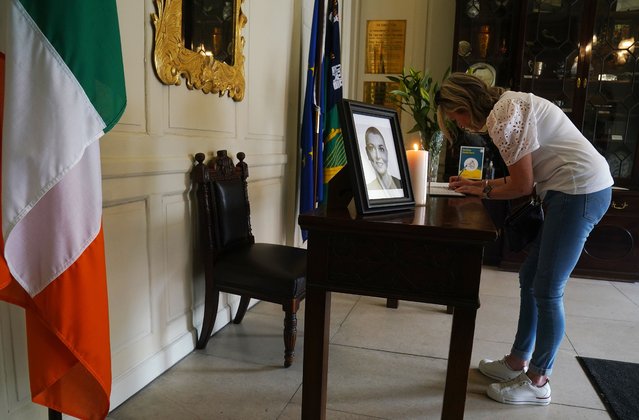 Noreen McKenna, from Skerries, signs a book of condolence for Sinead O'Connor at the Mansion House in Dublin on Friday, July 28, 2023, after her death at the age of 56. The Irish singer was found “unresponsive” at a home in Lambeth, south London on Wednesday. (Photo by Brian Lawless/PA Images via Getty Images)