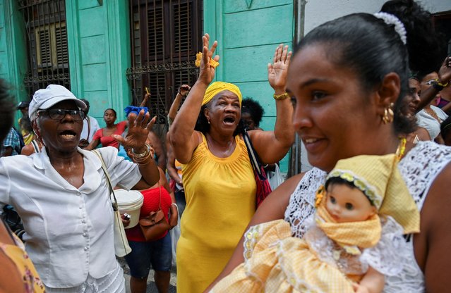 Followers of the Virgin of Charity, Oxun in the Yoruba religion, take part in a procession in Havana during the Oxun Day celebrations in Cuba on September 8, 2024. (Photo by Yamil Lage/AFP Photo)