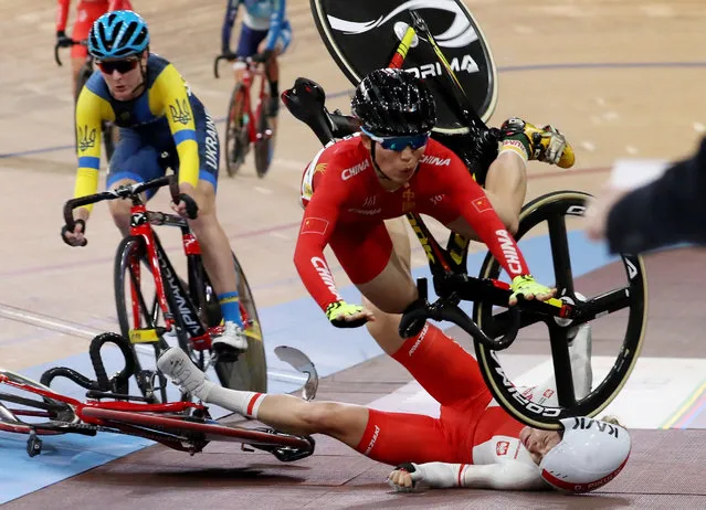 Xiaofei Wang of China (top) and Daria Pikulik of Poland (bottom) crash during the Women's Madison at the UCI Track Cycling World​ Championships at the Velodrom in Berlin, Germany, 29 February 2020. (Photo by Focke Strangmann/EPA/EFE)