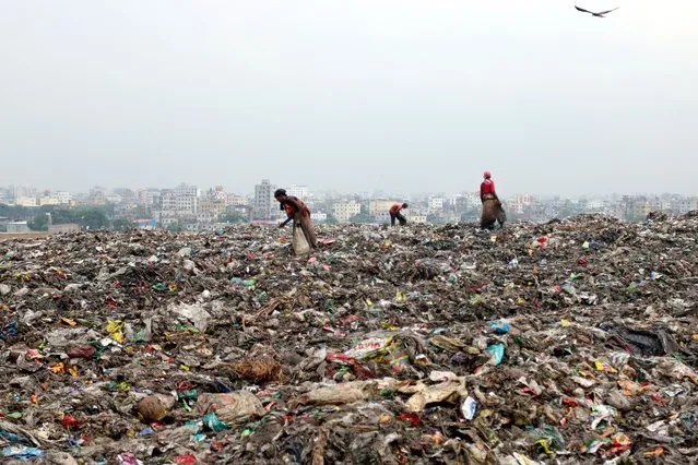 Pickers collect non-biodegradable waste at a garbage dump in Dhaka to be used in the recycling industry. In urban areas of Bangladesh around 25,000 tonnes of garbage is generated per day; Total solid waste is expected to increase to 47,000 tons per day by 2025. On July 26, 2022 in Dhaka, Bangladesh. (Photo credit should read Habibur Rahman/ Eyepix Group/Future Publishing via Getty Images)