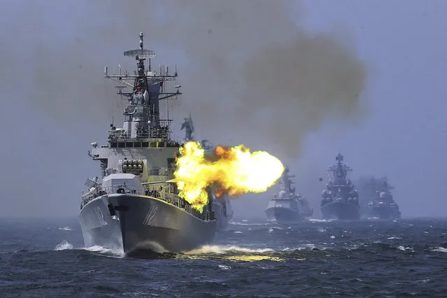 In this file photo taken Saturday, May 24, 2014, China's Harbin (112) guided missile destroyer takes part in a week-long China-Russia “Joint Sea-2014” navy exercise at the East China Sea off Shanghai, China. A Russian naval task force has arrived in the northern Chinese port of Qingdao ahead of joint naval exercises that reinforce the growing bond between Beijing and Moscow. (Photo by AP Photo)