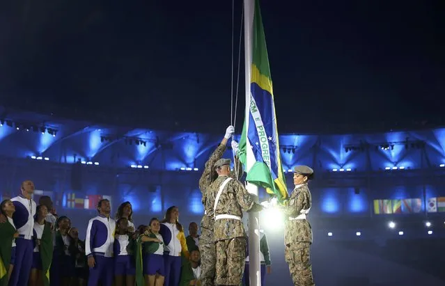 2016 Rio Olympics, Opening ceremony, Maracana, Rio de Janeiro, Brazil on August 5, 2016. The Brazilian national flag is raised during the opening ceremony. (Photo by Kai Pfaffenbach/Reuters)