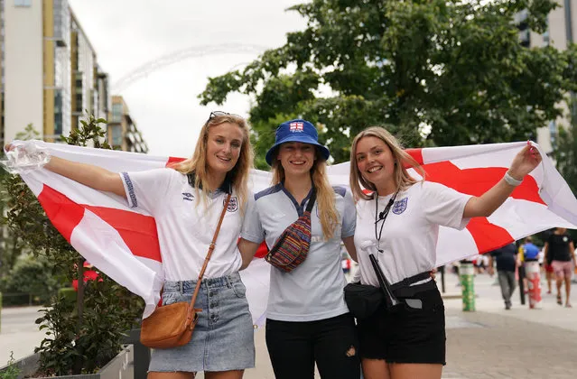 England fans pose for a photo on Wembley Way ahead of the UEFA Women's Euro 2022 final at Wembley Stadium, London on Sunday, July 31, 2022. (Photo by Joe Giddens/PA Wire)