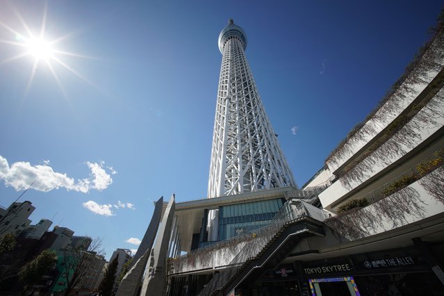 This photo taken on February 20, 2025 shows the base of the 634m-high (2,080 ft.) Tokyo Skytree in the Oshiage area of the Japanese capital. Originally planned to be 610 metres high, architects went even bigger and the Skytree was certified by Guinness World Records as the world's tallest tower when it opened in 2012. (Photo by Kazuhiro Nogi/AFP Photo)