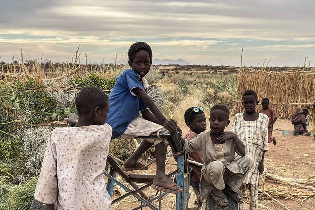 Displaced Sudanese children gather at a camp near the town of Tawila in North Darfur on February 11, 2025, amid the ongoing war between the army and paramilitary forces. Since April 2023, Sudan has been locked in a brutal conflict between army chief Abdel Fattah al-Burhan and his former deputy Mohamed Hamdan Daglo, who leads the paramilitary Rapid Support Forces. (Photo by Marwan Mohamed/AFP Photo)