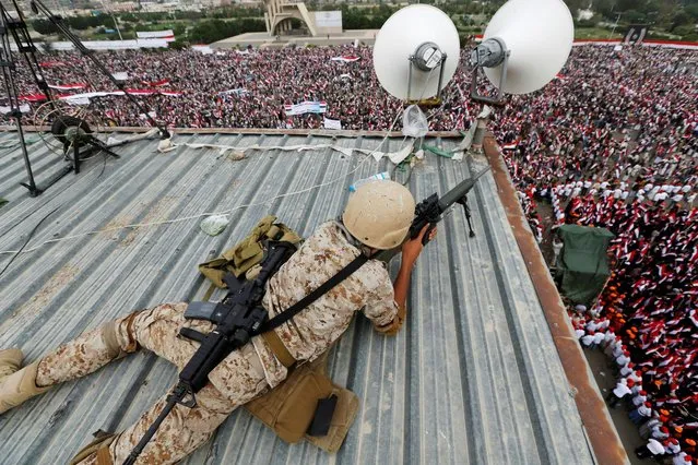 A sniper takes position as he secures a rally to show support to a political council formed by the Houthi movement and the General People's Congress party to unilaterally rule Yemen by both groups, in the capital Sanaa August 20, 2016. (Photo by Khaled Abdullah/Reuters)