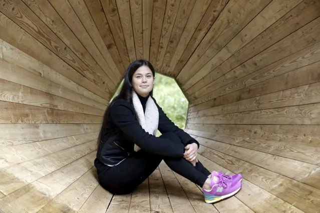 Interior architecture student Birgit Oigus poses for a picture in the wooden megaphone in the forest near Pahni village, Estonia, September 28, 2015. If you go down to the woods in Estonia today, you're sure of a big surprise: three large-scale wooden megaphones have been set up by architecture students for visitors to climb inside. (Photo by Ints Kalnins/Reuters)