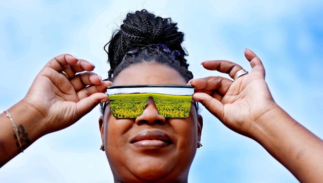 Vanessa Carson from Brazil looking at a field of Rapeseed in Athy Co Kildare, Republic of Ireland on Sunday, April 13, 2025. (Photo by Niall Carson/PA Wire)