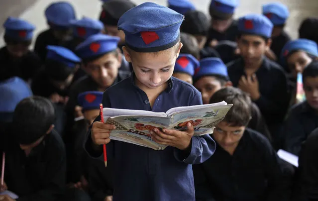Pakistani boys attend school a day ahead of the International Literacy Day in Peshawar, Pakistan, 07 September 2015. International Literacy Day is observed on 08 September annually and the theme this year is “Literacy and Sustainable Societies”. (Photo by Bilawal Arbab/EPA)