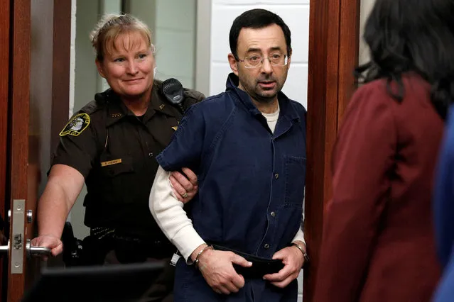 Larry Nassar, a former team USA Gymnastics doctor, who pleaded guilty in November 2017 to sexual assault charges, is escorted into the courtroom during his sentencing hearing in Lansing, Michigan, U.S., January 18, 2018. (Photo by Brendan McDermid/Reuters)