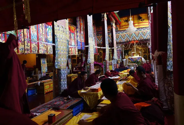 Tibetan monks pray inside the Jokhang Temple in the early morning in Lhasa, Tibet Autonomous Region, China, 10 September 2016. Jokhang Temple is considered one of the most sacred site for Tibetan buddhists built during the rule of King Songtsen Gampo in the 7th century. (Photo by How Hwee Young/EPA)