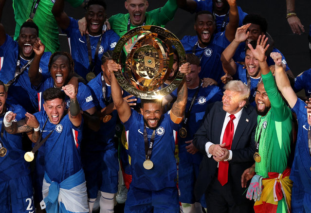 Chelsea's Reece James lifts the trophy as he celebrates with teammates after winning the FIFA Club World Cup as U.S. President Donald Trump looks on at MetLife Stadium on July 13, 2025. (Photo by Amanda Perobelli/Reuters)