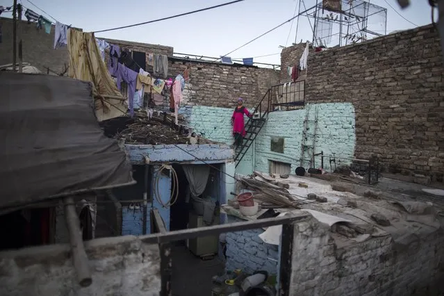 A girl looks over at her house at a Christian slum in Islamabad December 4, 2014. (Photo by Zohra Bensemra/Reuters)