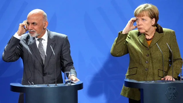 German Chancellor Angela Merkel (R) and Afghani President Ashraf Ghani take part in a press conference at the Federal Chancellery in Berlin, Germany, 05 December 2014. Ashraf Ghani is making his first official visit to Germany since becoming President. (Photo by Wolfgang Kumm/EPA)