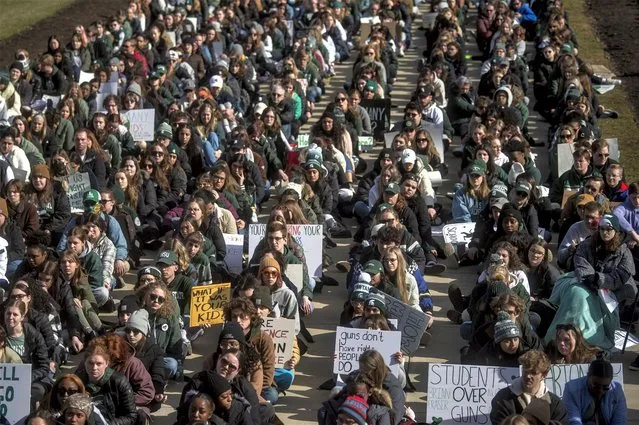 More than 1,000 Michigan State University students and concerned Michigan residents joined a sit-in protest on Monday, February 20, 2023, at the Capitol in Lansing, Mich., one week after a gunman killed three students and injured five others. (Photo by Jake May/The Flint Journal via AP Photo)