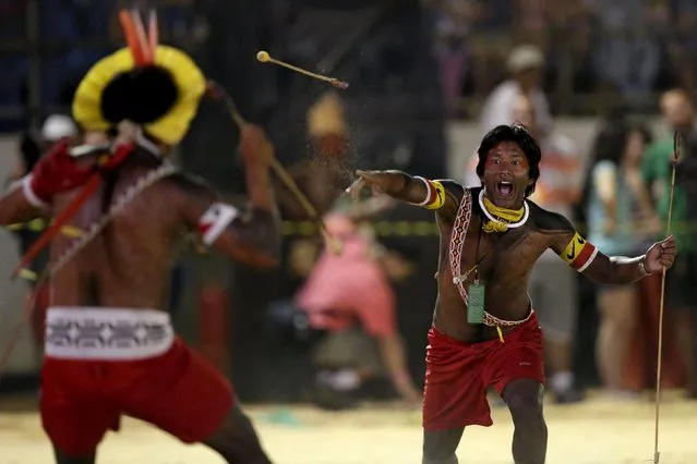 Indigenous men from the Kamayura tribe take part in a demonstration of an indigenous Kamayura game at the first World Games for Indigenous Peoples in Palmas, Brazil, October 29, 2015. (Photo by Ueslei Marcelino/Reuters)