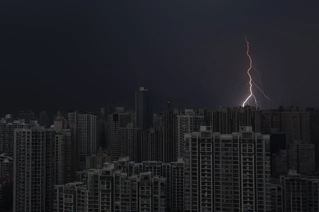 Lightning is seen above buildings during a storm in central Shanghai, August 15, 2012. (Photo by Aly Song/Reuters)