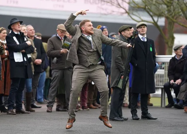A racegoer celebrates a winning bet in the Pertemps Network Final Handicap Hurdle on day three of the Cheltenham Festival at Cheltenham Racecourse on Thursday, March 16, 2023. (Photo by Joe Giddens/PA Images via Getty Images)