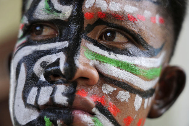 A man, his face painted in the likeness of a spirit, participates in the He Neak Ta rituals in Phum Boeung village, northwest of Phnom Penh, Cambodia, Tuesday, June 11, 2024. Cambodian villagers on Tuesday took part in a rare traditional guardian spirit ceremony praying for good fortune, rain and prosperity, as they aimed to preserve this ancient tradition. (Photo by Heng Sinith/AP Photo)