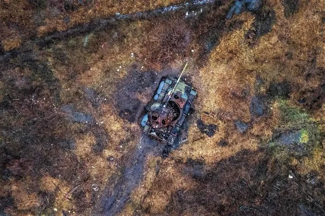 This aerial photograph shows a destroyed tank in a field in the village of Kamenka, Kharkiv region on February 26, 2023, amid the Russian invasion of Ukraine. (Photo by Ihor Tkachov/AFP Photo)