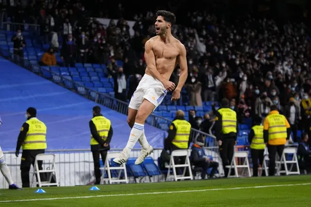 Real Madrid's Marco Asensio celebrates after scoring during a Spanish La Liga soccer match between Real Madrid and Granada at the Bernabeu stadium in Madrid, Spain, Sunday, February 6, 2022. (Photo by Manu Fernandez/AP Photo)