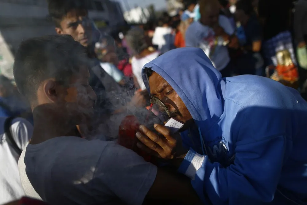 New Year Devotees Feast the Saint of Death